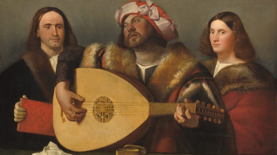 Renaissance painting showing a small group of musicians seated indoors, playing lutes and other instruments around a table, with detailed costumes, warm lighting, and rich interior décor, capturing an intimate concert scene.
