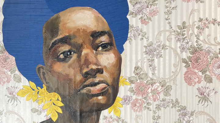 A portrait of a Black woman with large earrings like leaves and wearing a blue cami top. She has a pensive look on her face. She is against a floral wallpaper background; the pattern of the wallpaper is subtly in relief on her skin.