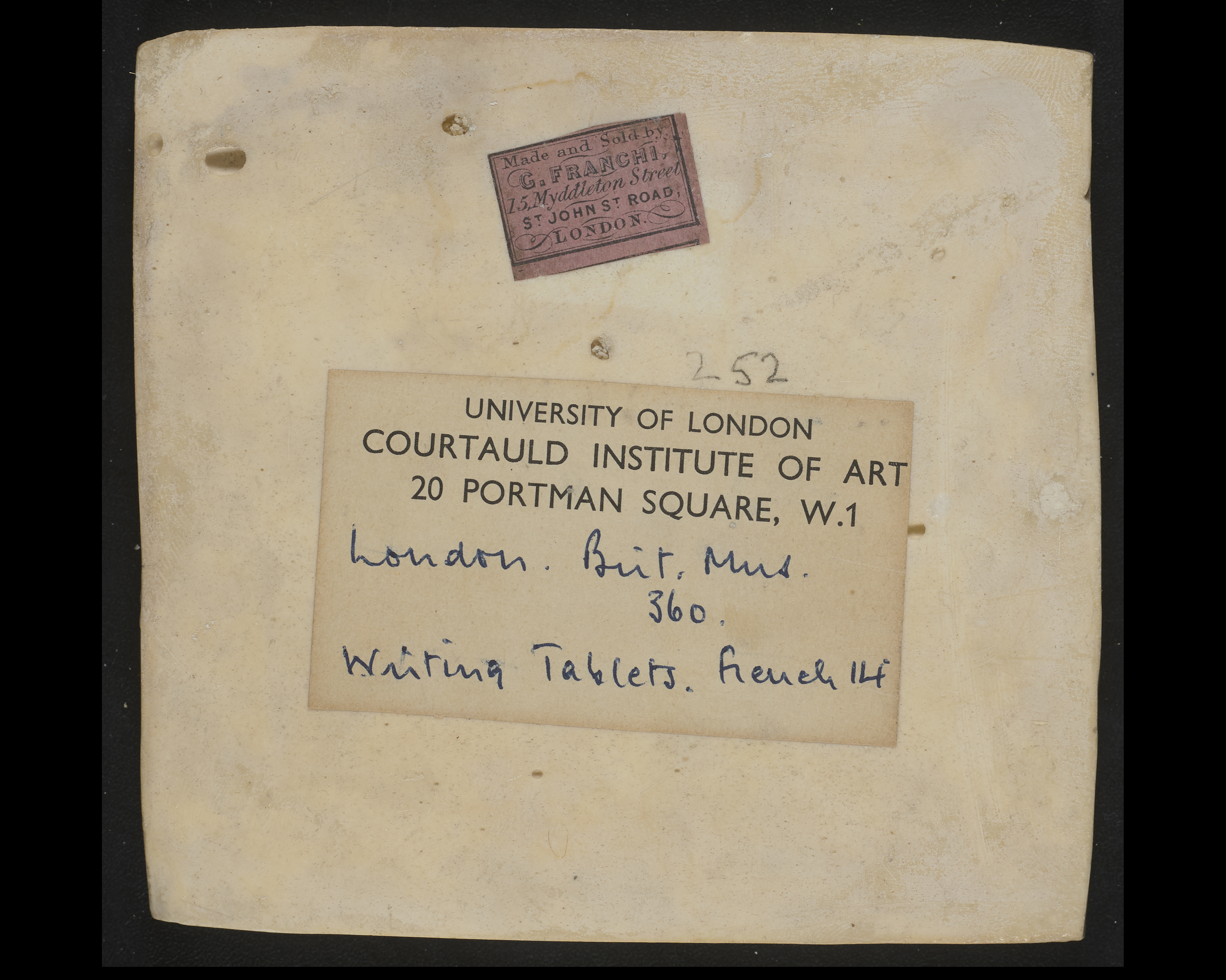 back of the ivory dyptich, it displays a sticker with text